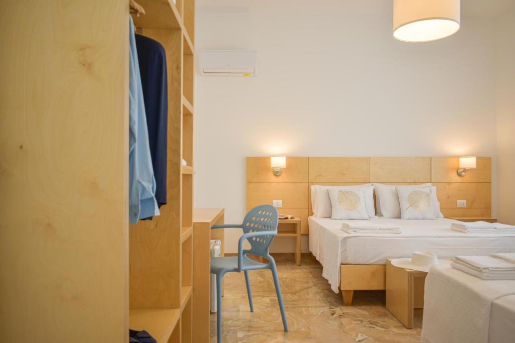 A bed or beds in a room at Ammarèa B&B