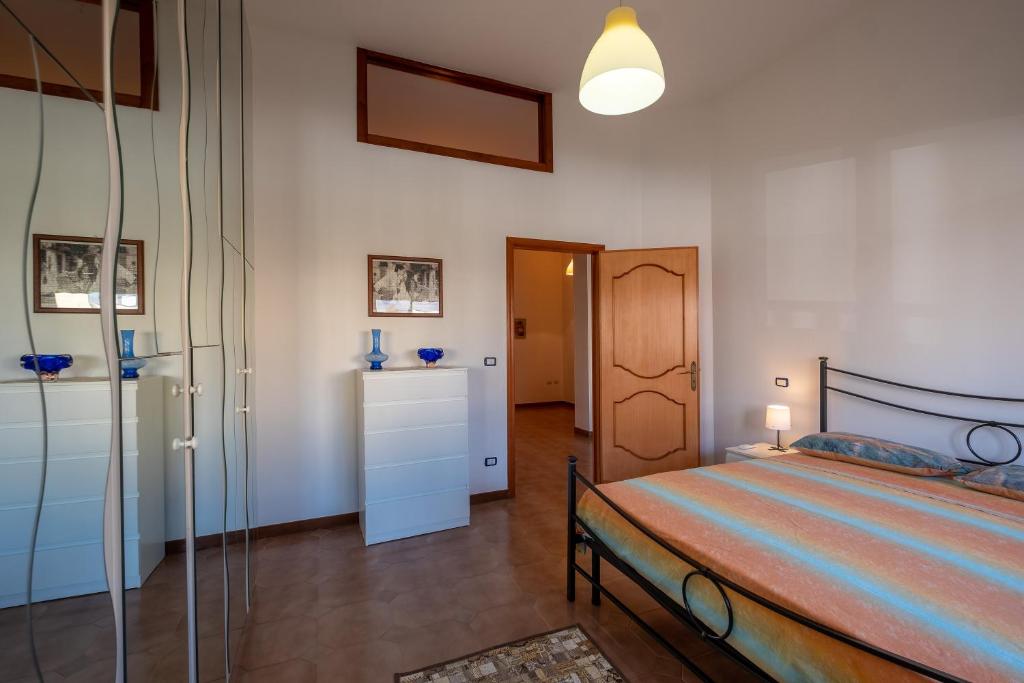 A bed or beds in a room at Casa Ginevra Salento
