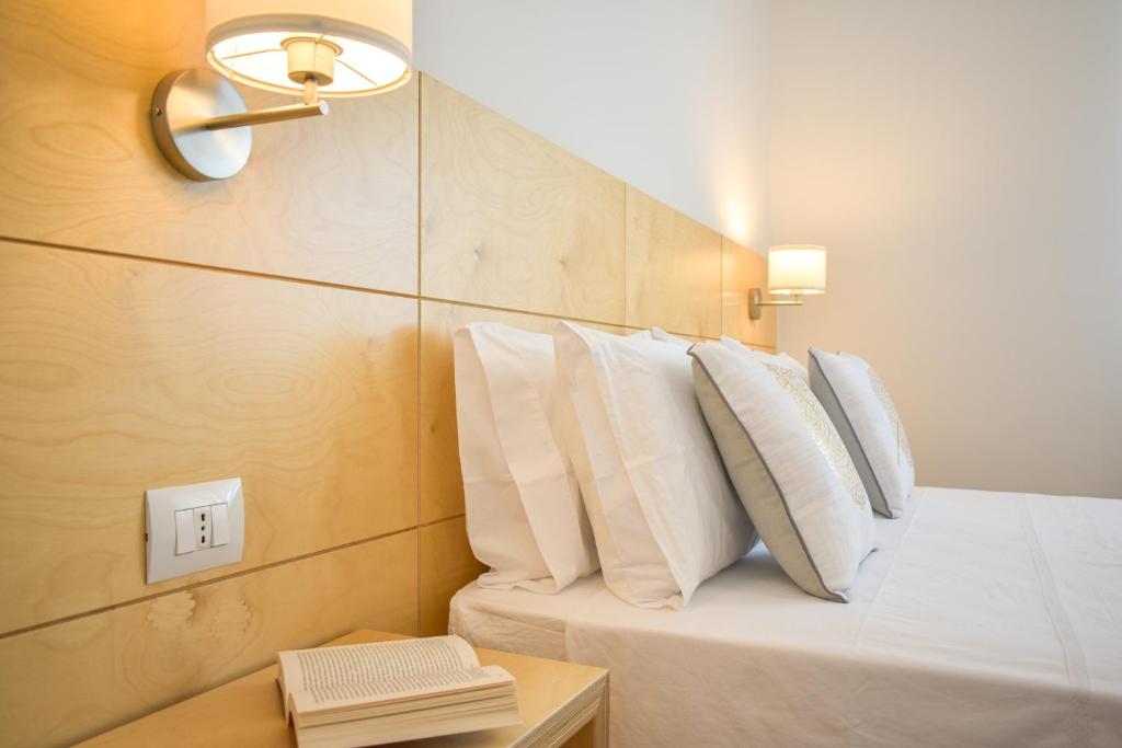 A bed or beds in a room at Ammarèa B&B