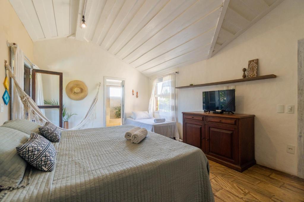 Ein Bett oder Betten in einem Zimmer der Unterkunft Morada do Sol Guest House