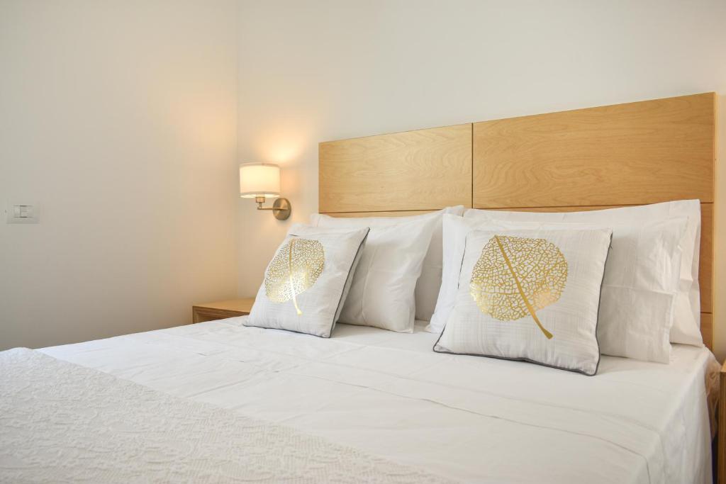 A bed or beds in a room at Ammarèa B&B