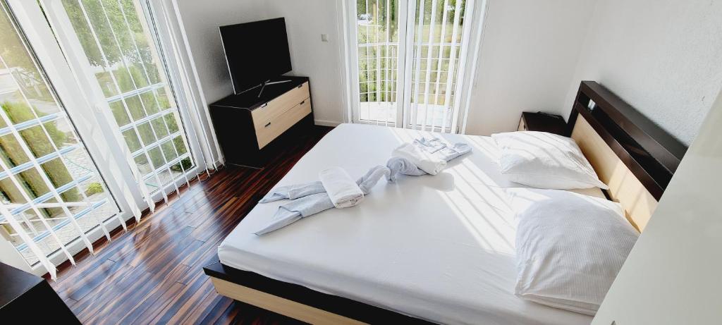 Postel nebo postele na pokoji v ubytování Motel Bella