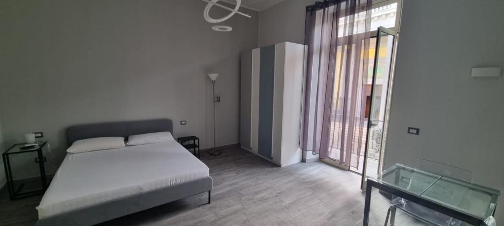 Posteľ alebo postele v izbe v ubytovaní Centonze Apt - Messina centro