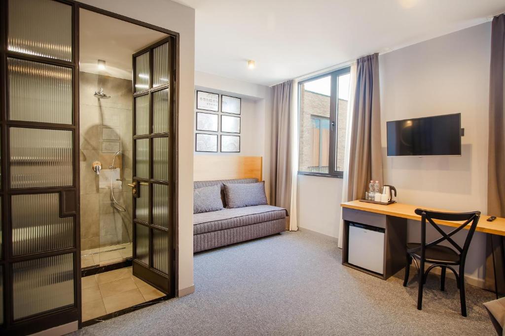 TV a/nebo společenská místnost v ubytování Hotel Tuta
