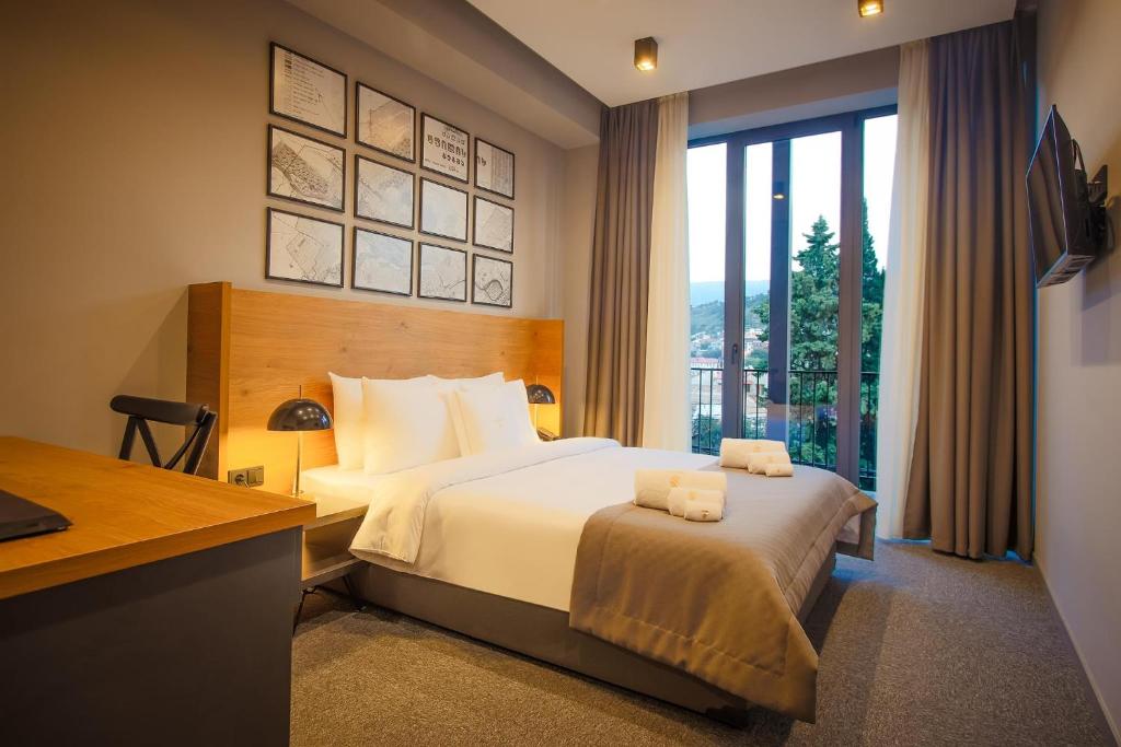 Кровать или кровати в номере Hotel Tuta