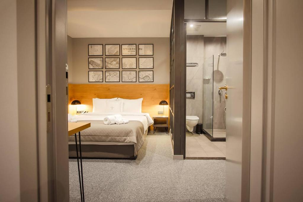 Postel nebo postele na pokoji v ubytování Hotel Tuta