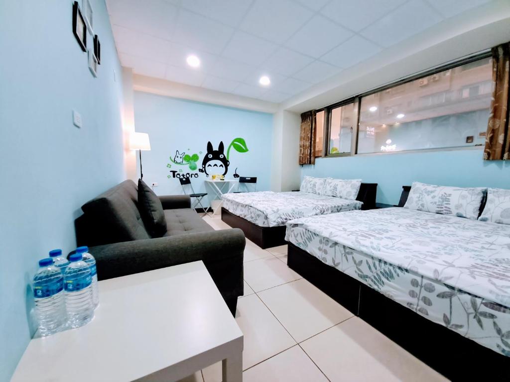 Postel nebo postele na pokoji v ubytování Ming House