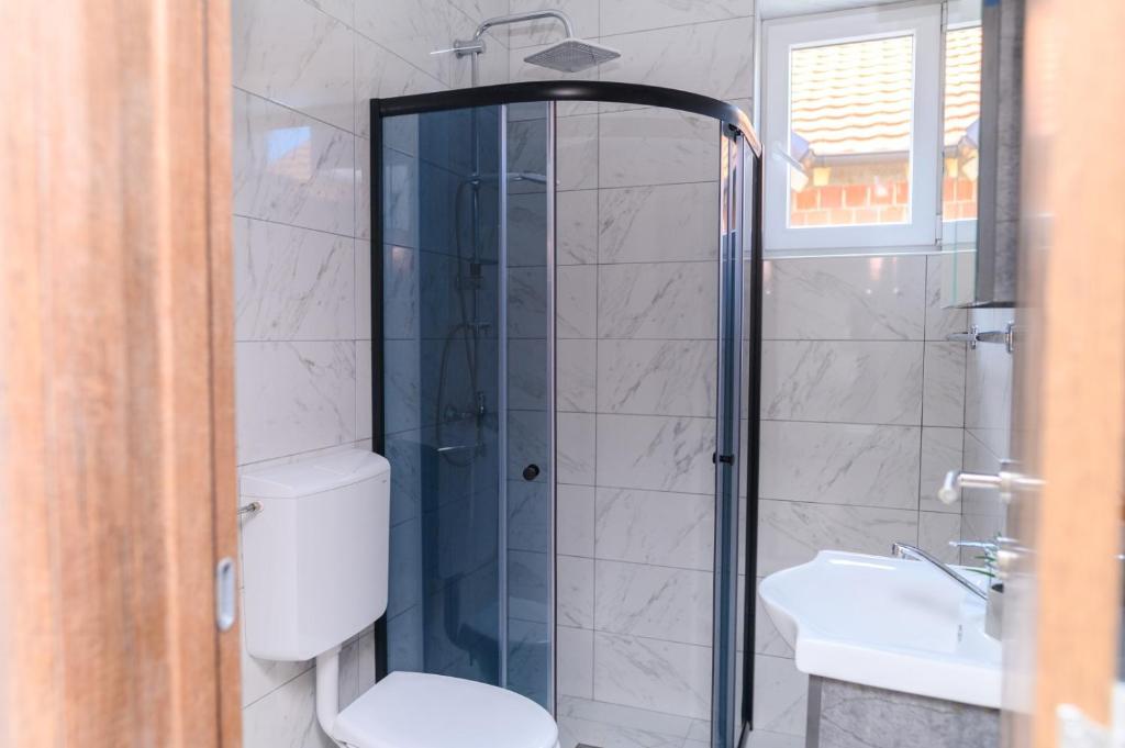 Koupelna v ubytování Apartmani ZAT