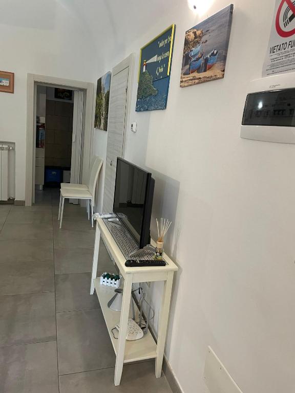 Televízia a/alebo spoločenská miestnosť v ubytovaní Go To Monopoli