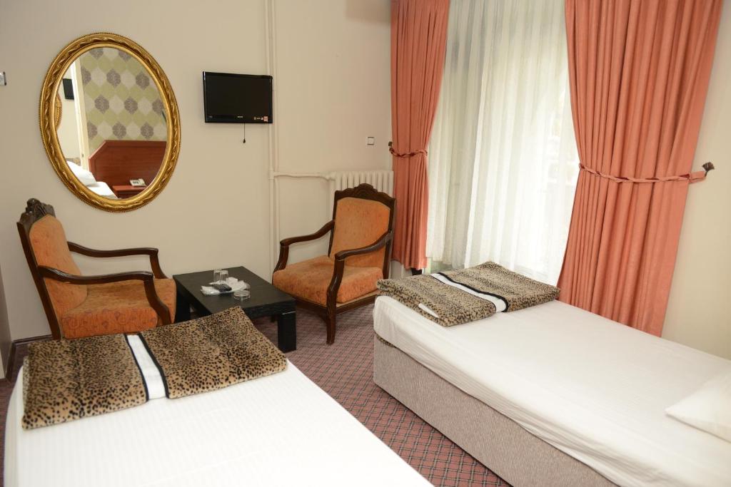 Ένα ή περισσότερα κρεβάτια σε δωμάτιο στο Hotel Soydan