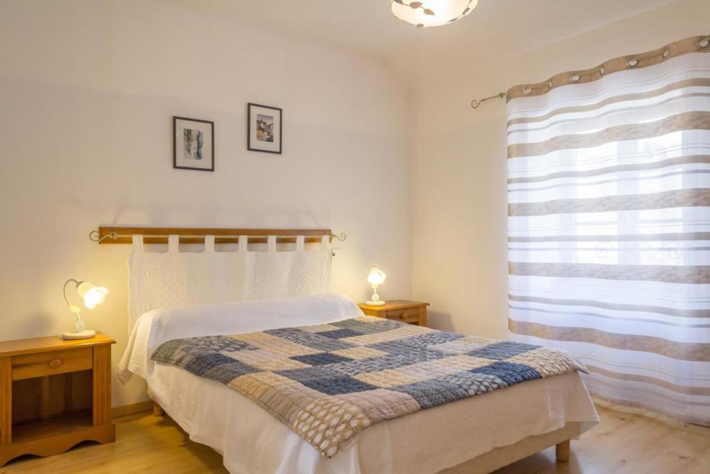 Postel nebo postele na pokoji v ubytování Logis de l'Orme