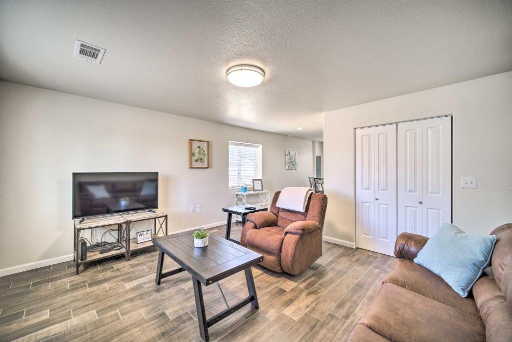 a living room with two couches and a tv at Welcoming Carlsbad Home Near Parks and Town! in Carlsbad