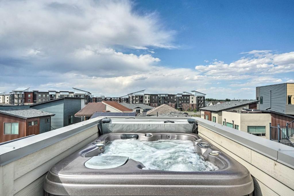 a hot tub on the roof of a building at Spacious Old Town North Home with Rooftop Deck! in Fort Collins