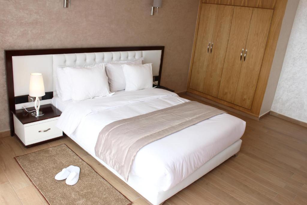 Postel nebo postele na pokoji v ubytování Hotel Club Almoggar Garden Beach