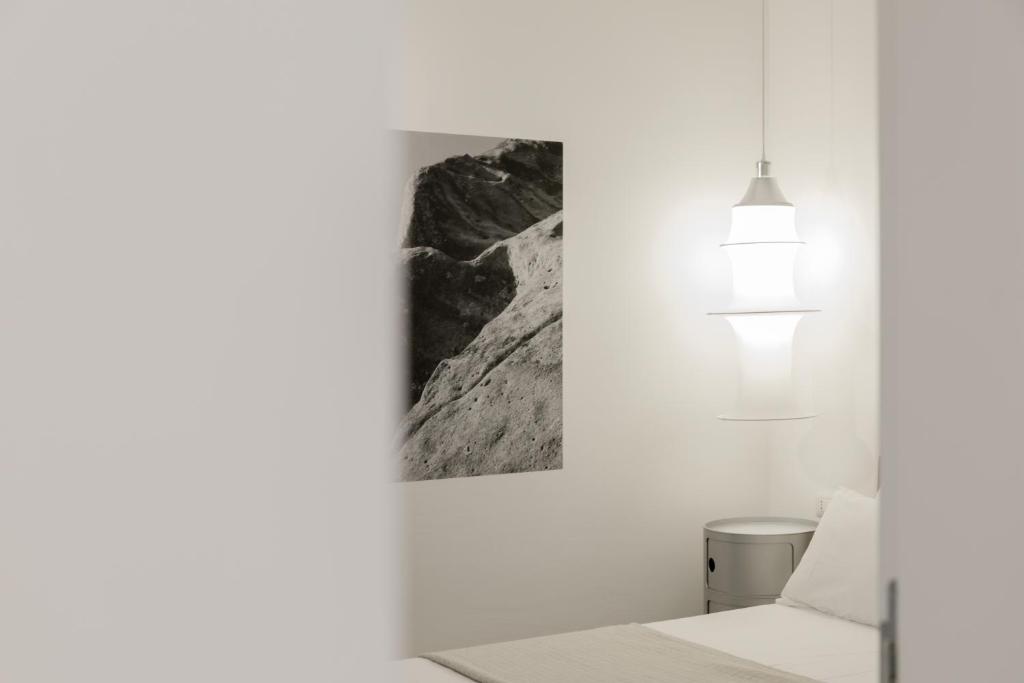 Postel nebo postele na pokoji v ubytování Hotel Dolomiti