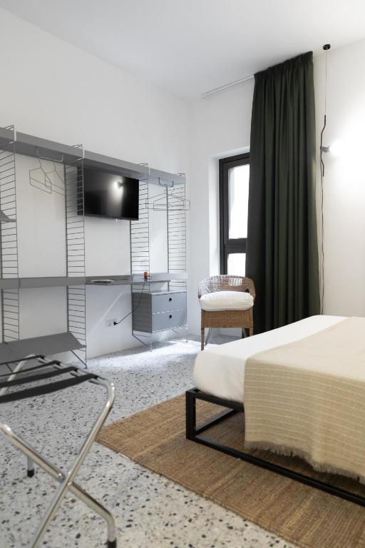 Postel nebo postele na pokoji v ubytování Hotel Dolomiti