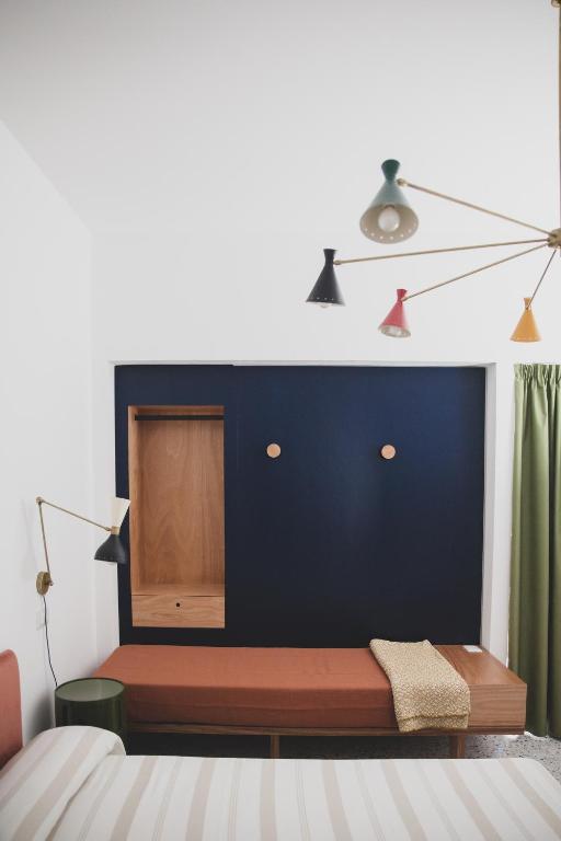 Postel nebo postele na pokoji v ubytování Hotel Dolomiti