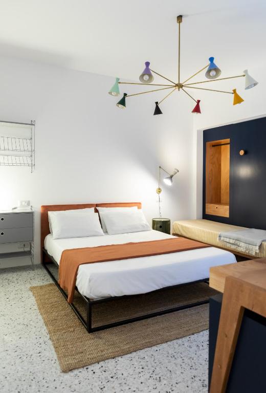 Postel nebo postele na pokoji v ubytování Hotel Dolomiti