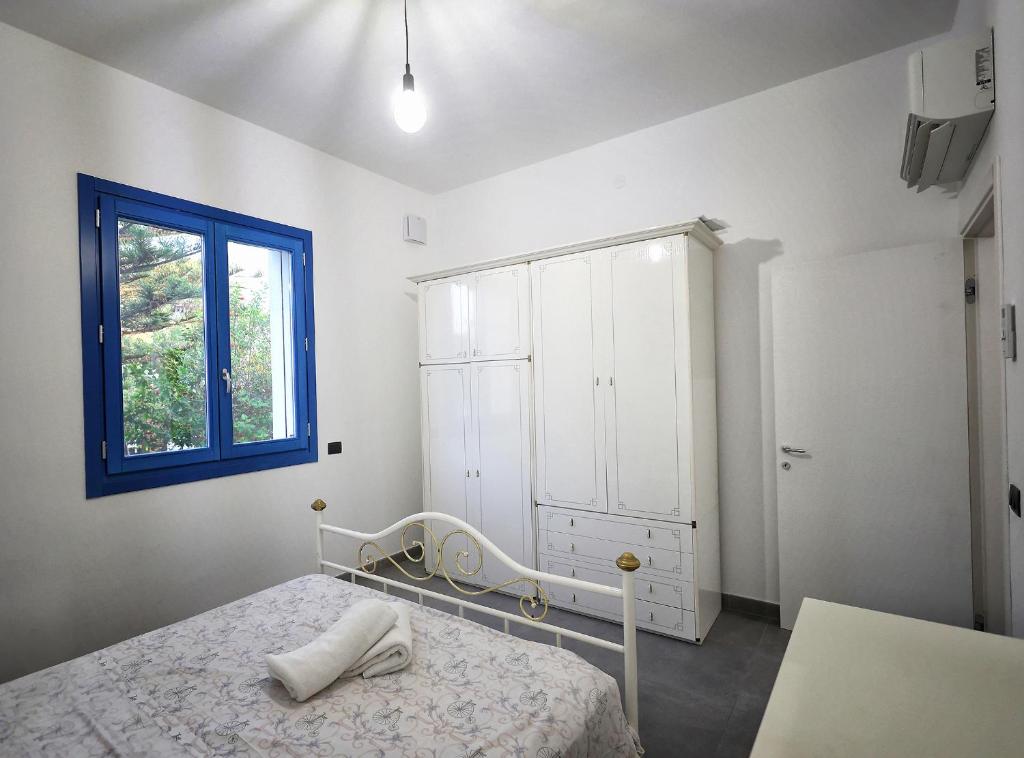 Postel nebo postele na pokoji v ubytování Villa Marzia & Villa Carmela