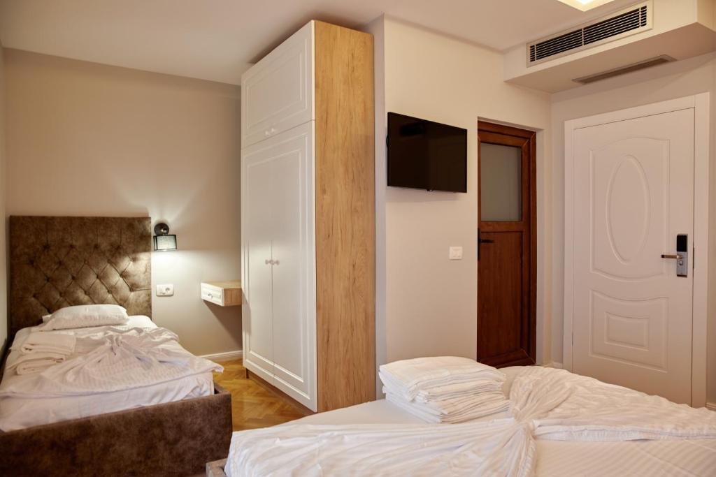 Postel nebo postele na pokoji v ubytování Amico Hotel