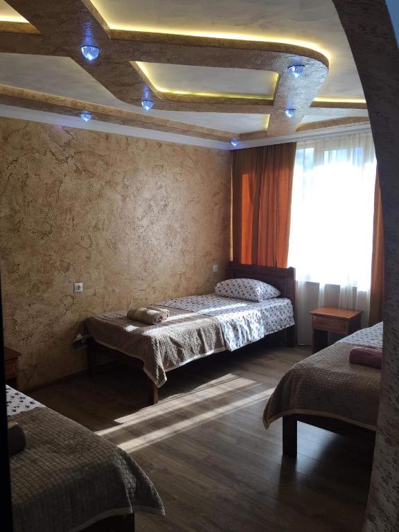 Postel nebo postele na pokoji v ubytování Guest House Diana