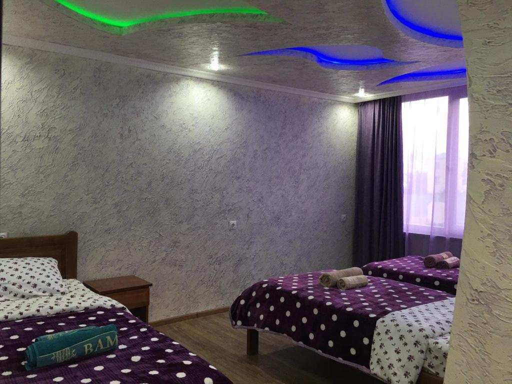 Postel nebo postele na pokoji v ubytování Guest House Diana