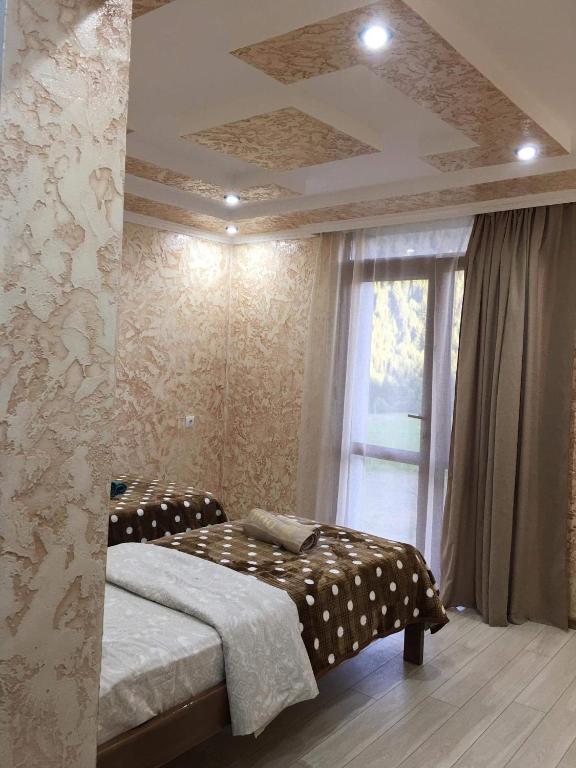 Postel nebo postele na pokoji v ubytování Guest House Diana