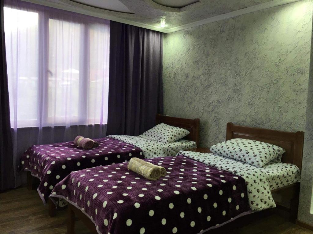 Postel nebo postele na pokoji v ubytování Guest House Diana