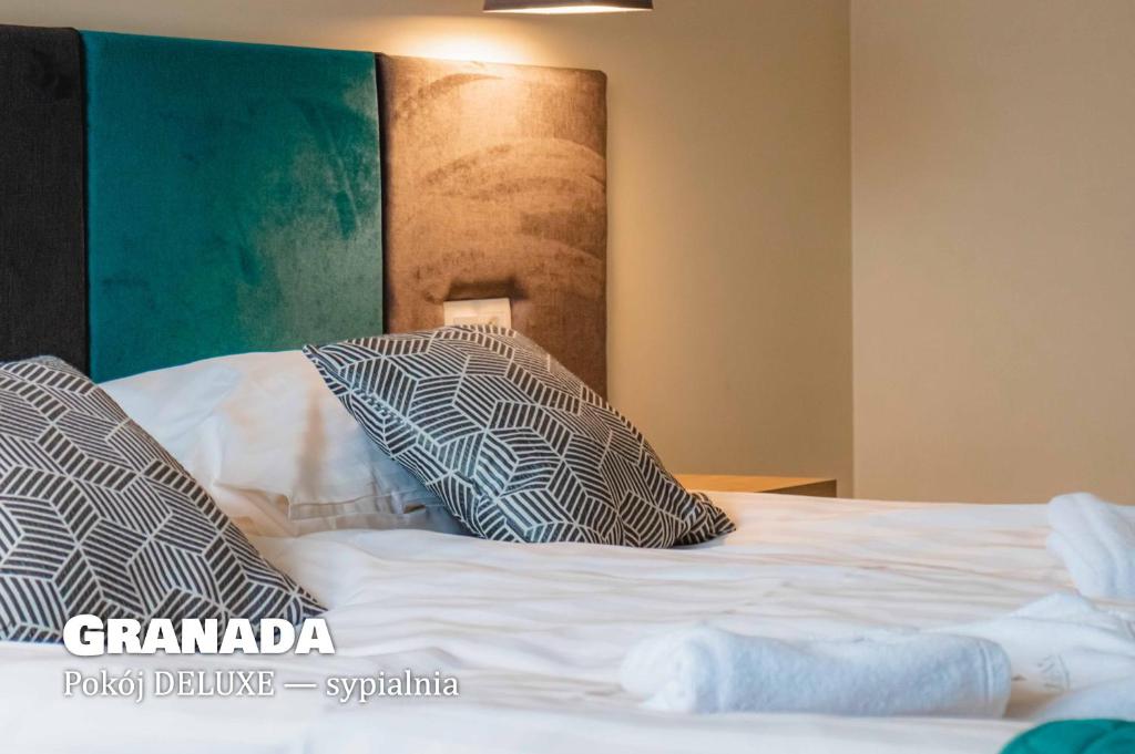 Posteľ alebo postele v izbe v ubytovaní Granada Pensjonat & SPA