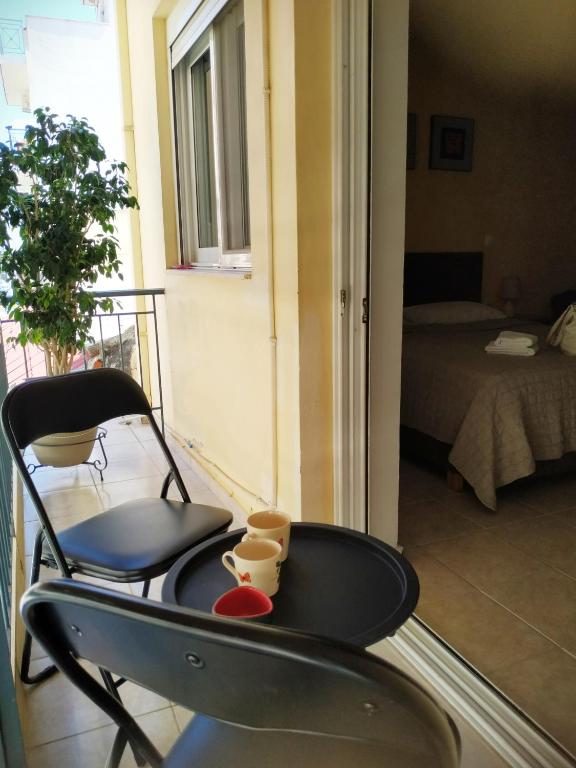 A bed or beds in a room at OSCAR STUDIO KALAMATA city centre
