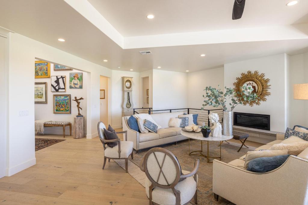 a living room filled with furniture and a fireplace at Taking Flight in Ivins