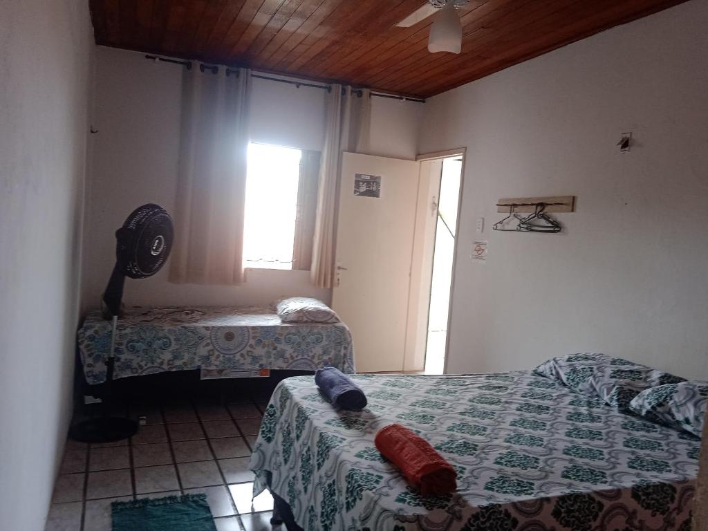 Postel nebo postele na pokoji v ubytování Hostel mineiros