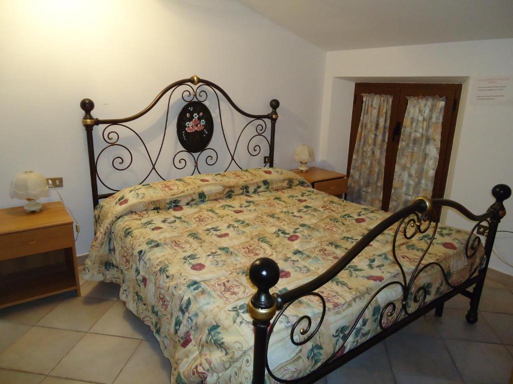 Postel nebo postele na pokoji v ubytování Agriturismo Grisciano