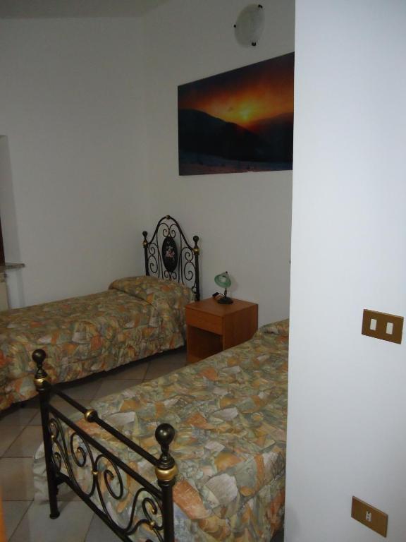 Postel nebo postele na pokoji v ubytování Agriturismo Grisciano
