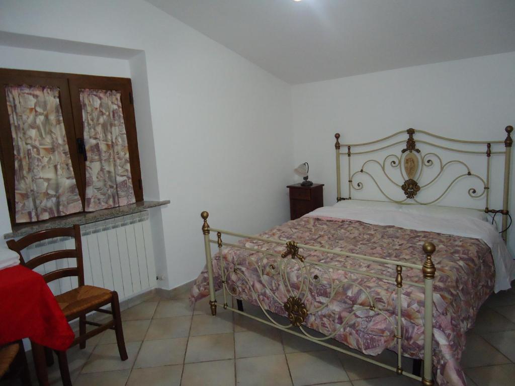Postel nebo postele na pokoji v ubytování Agriturismo Grisciano