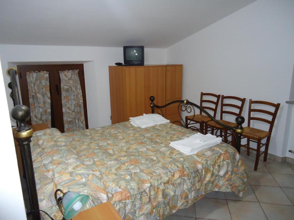 Postel nebo postele na pokoji v ubytování Agriturismo Grisciano