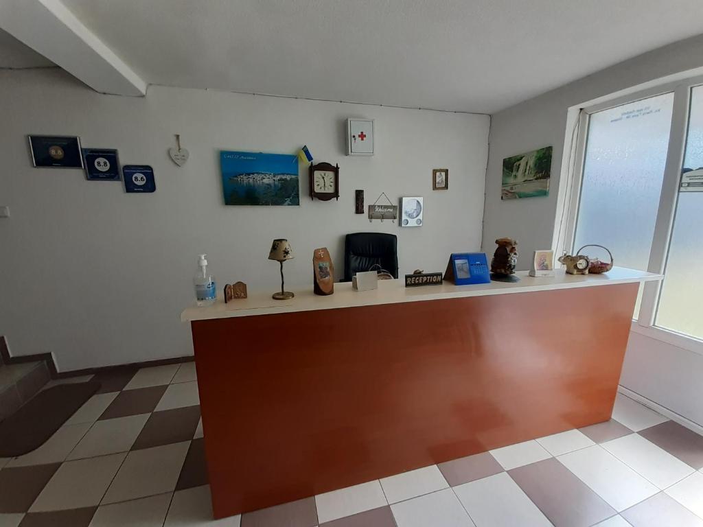 a waiting room with a counter with figurines on it at Guest House Zarnovel Palace in Ohrid