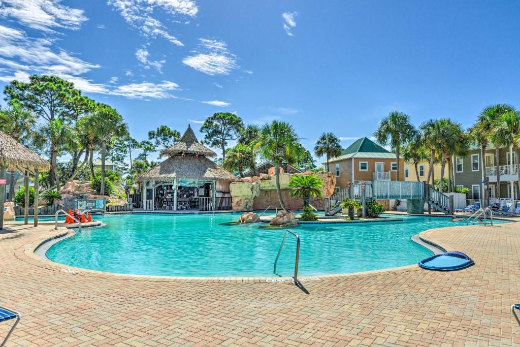a swimming pool at a resort at Sunny Perdido Key Cottage with On-Site Tiki Bar in Pensacola