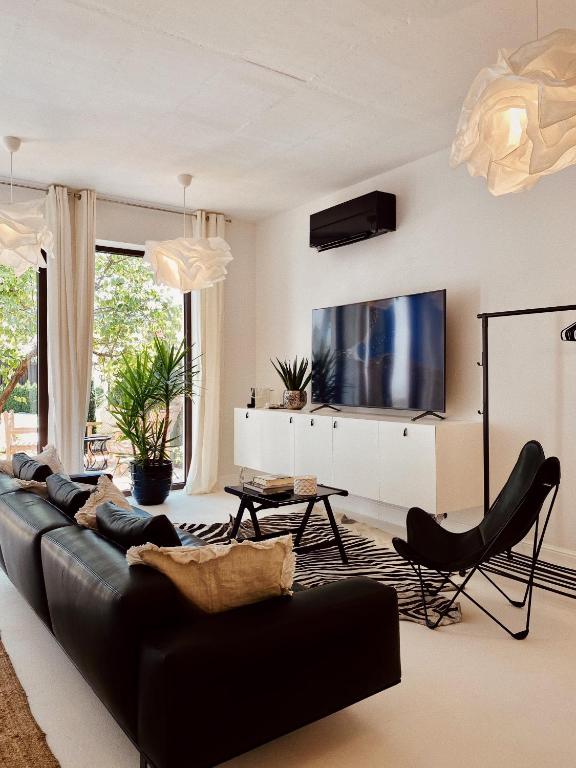 TV a/nebo společenská místnost v ubytování Villa Pomona
