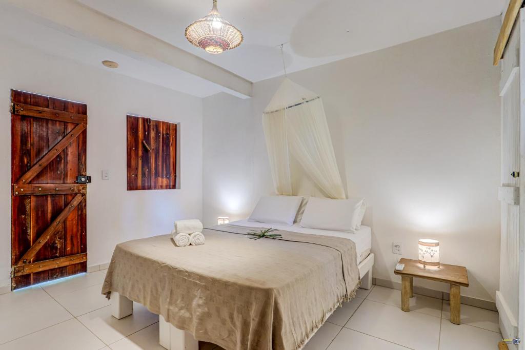 Cama ou camas em um quarto em Pousada Ilha Verde