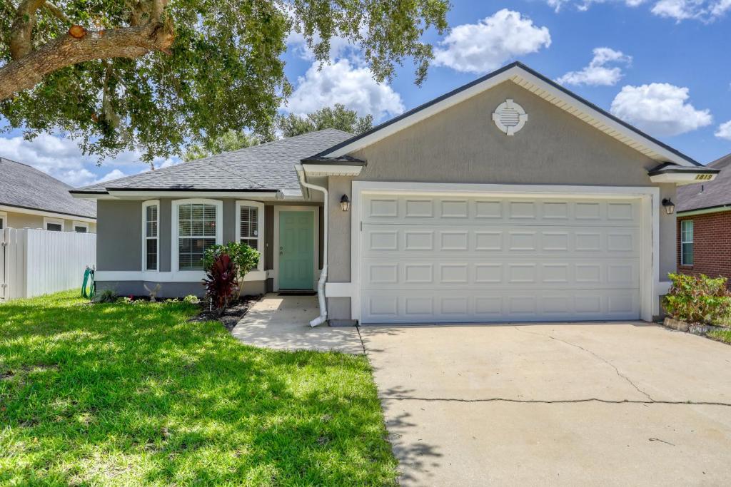 a house with a driveway and a garage at Hawkins Cove in Sandalwood