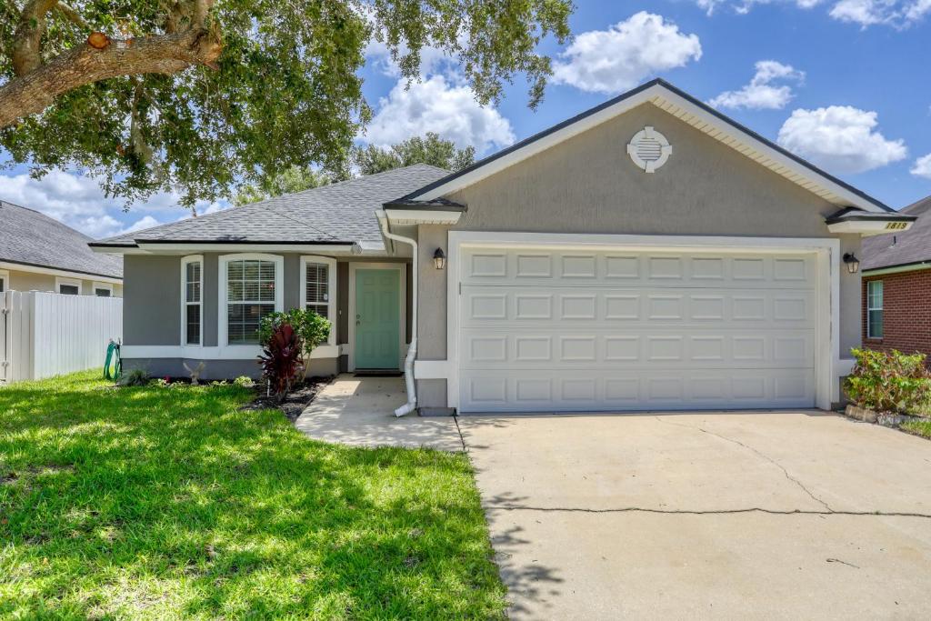a house with a driveway and a garage at Hawkins Cove in Jacksonville
