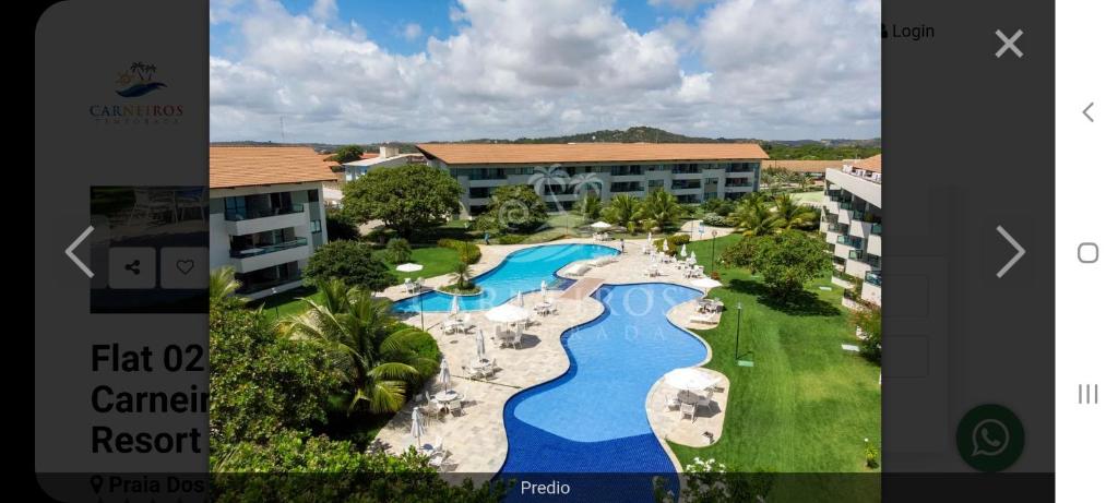 an aerial view of a resort with a swimming pool at Praia dos Carneiros Flat 206 C in Tamandaré