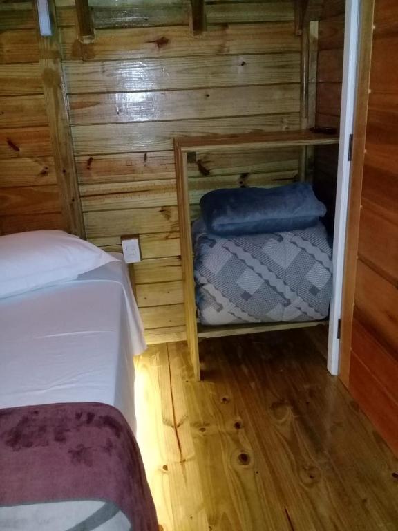 Postel nebo postele na pokoji v ubytování Chalés Snow