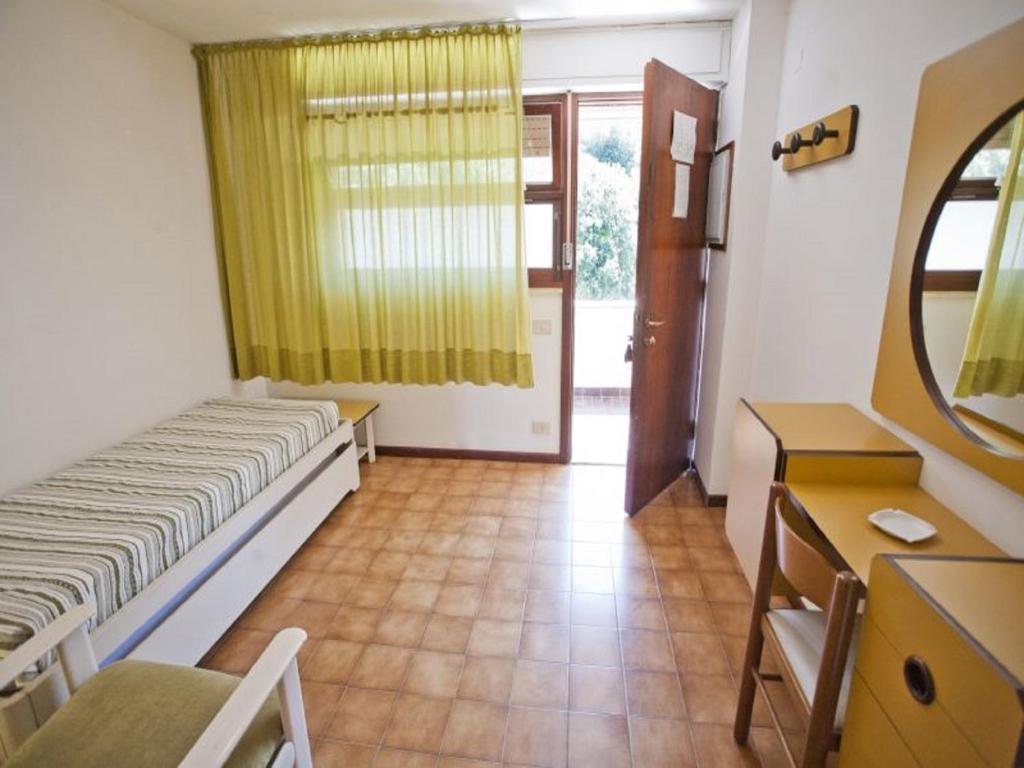 Postel nebo postele na pokoji v ubytování Residence Napoleon - HelloElba