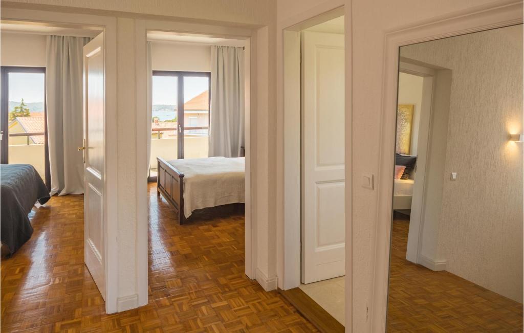 Postel nebo postele na pokoji v ubytování Apartment Biskupija Iv