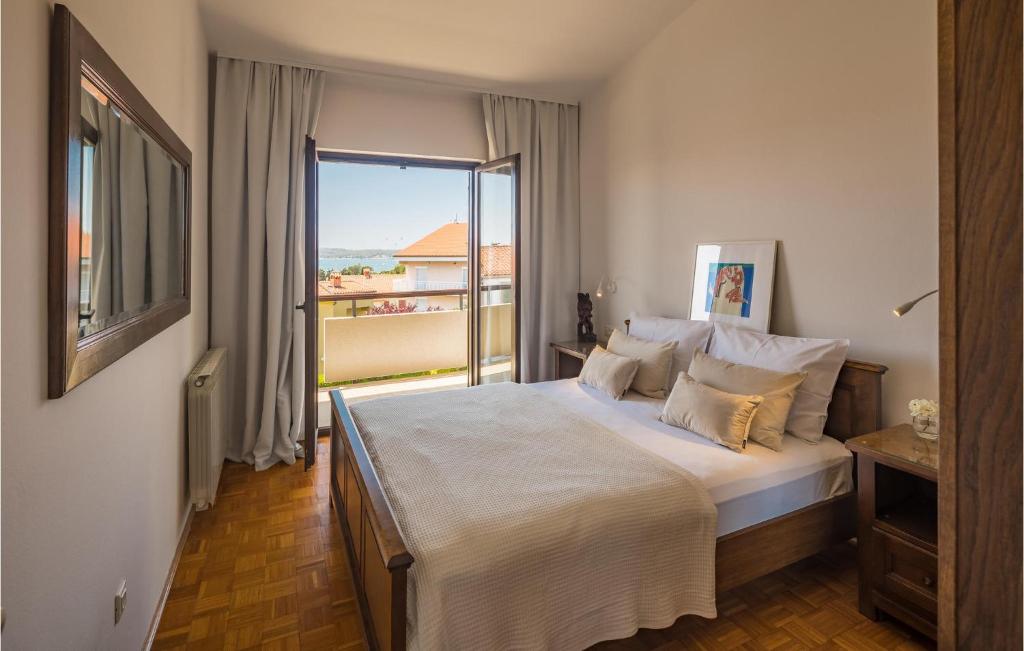 Postel nebo postele na pokoji v ubytování Apartment Biskupija Iv