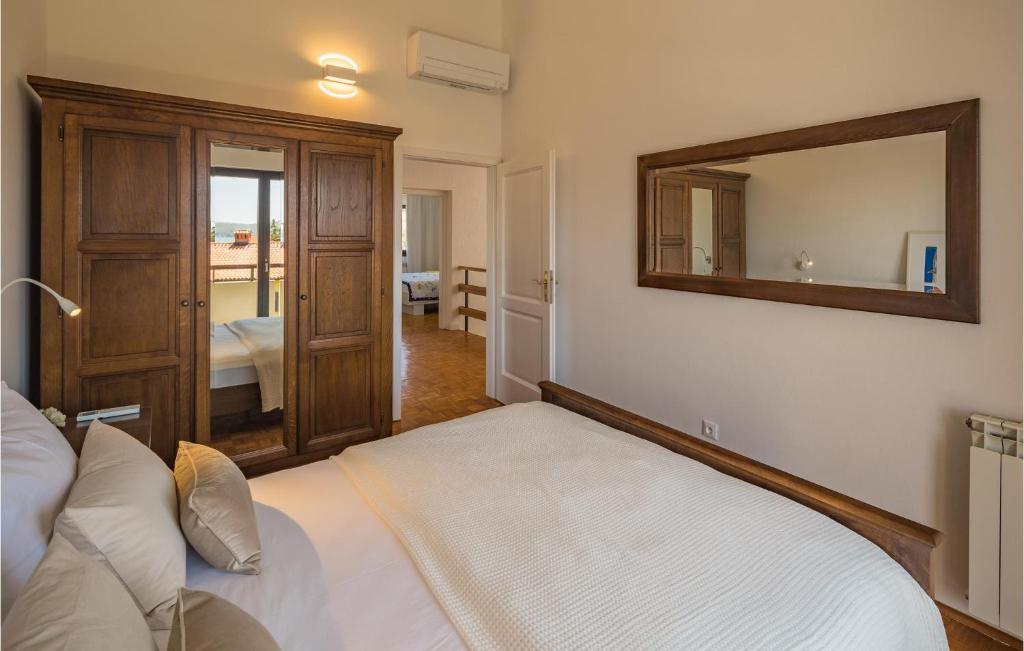 Postel nebo postele na pokoji v ubytování Apartment Biskupija Iv
