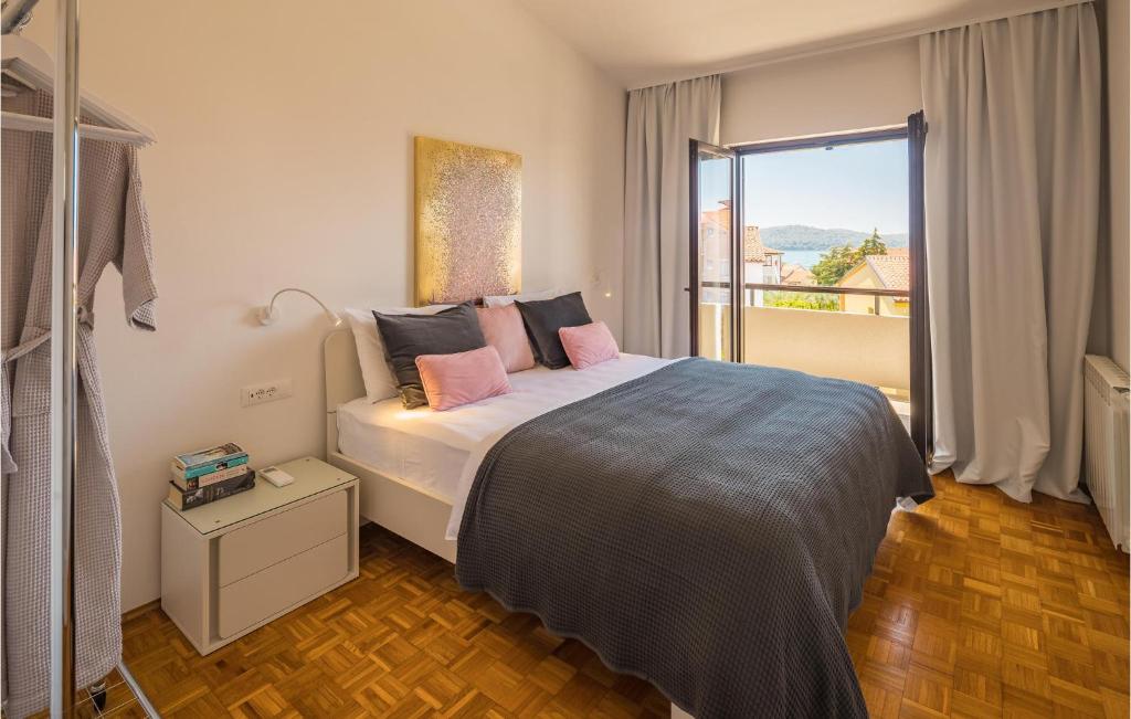 Postel nebo postele na pokoji v ubytování Apartment Biskupija Iv