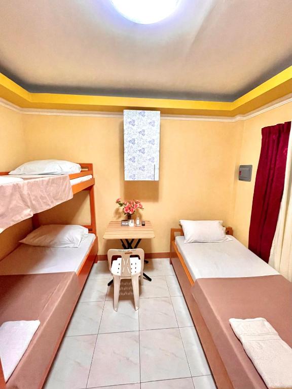 Postel nebo postele na pokoji v ubytování Wency Amor Hotel